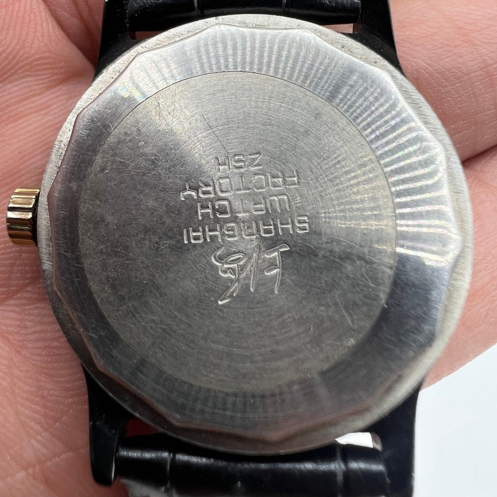 Shanghai Factory 34mm manual mechanical watch with black dial, 19 jewels, shock-resistant for daily use.