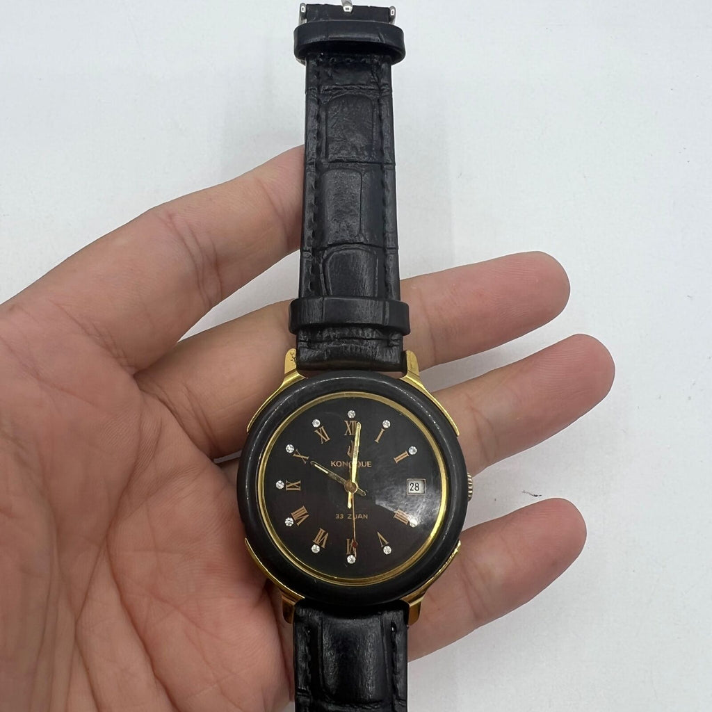 37mm automatic mechanical watch with black dial, golden Roman numerals, and 33 jewels.