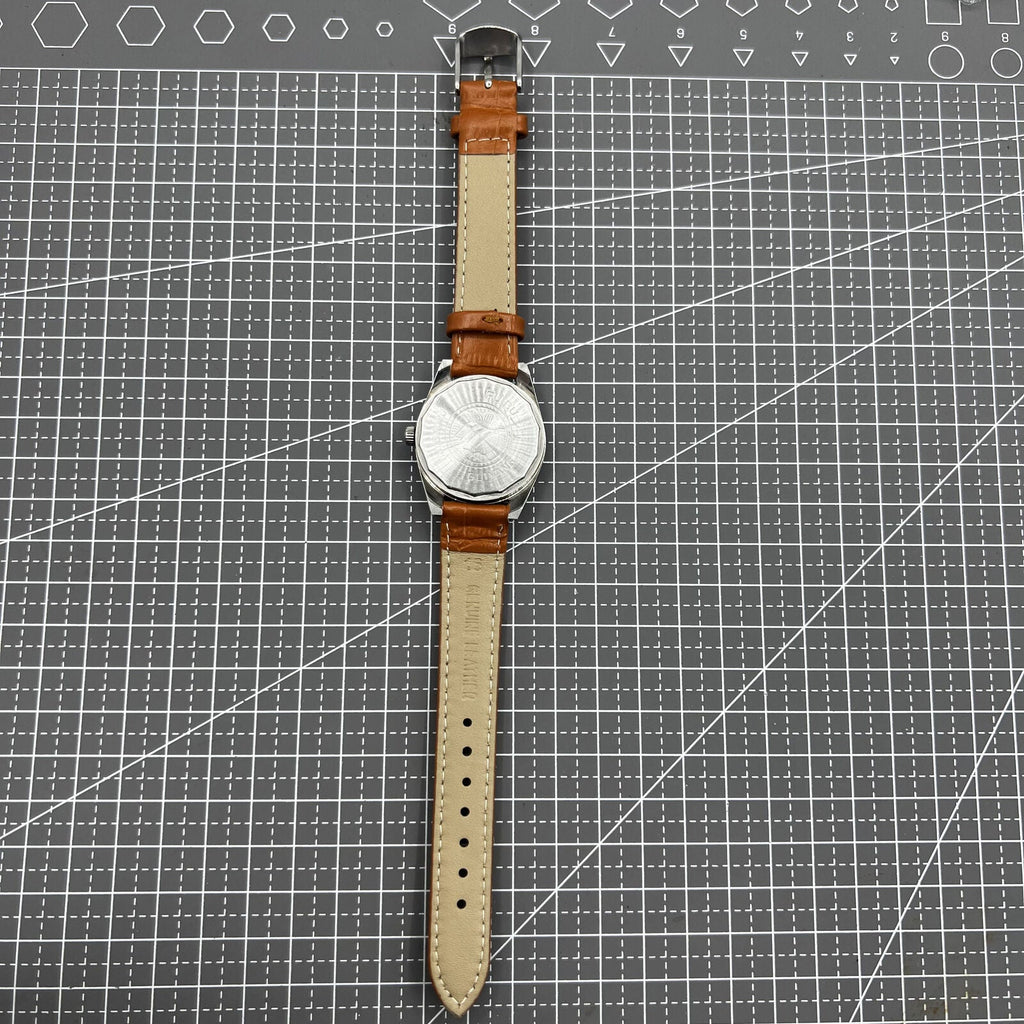 PUBU 32mm manual mechanical watch with grey dial, nail markers, 17 jewels, showcasing precision craftsmanship.