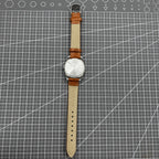 PUBU 32mm manual mechanical watch with grey dial, nail markers, 17 jewels, showcasing precision craftsmanship.