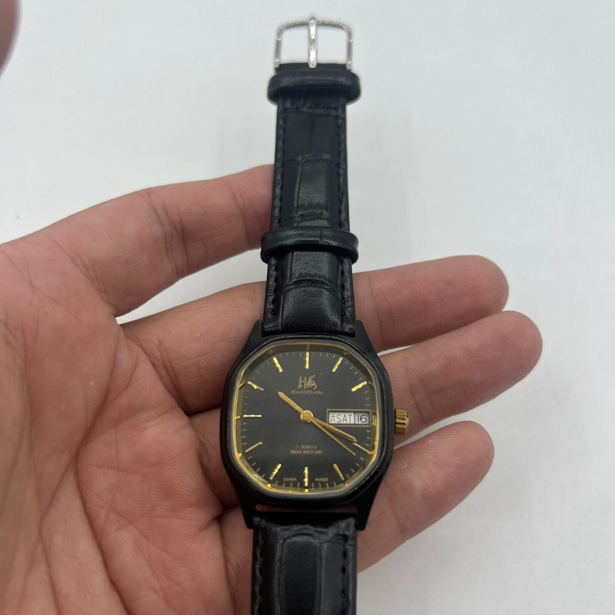 33mm Shanghai Factory manual mechanical watch with double calendar, black dial, showcasing classic elegance and precise craftsmanship.