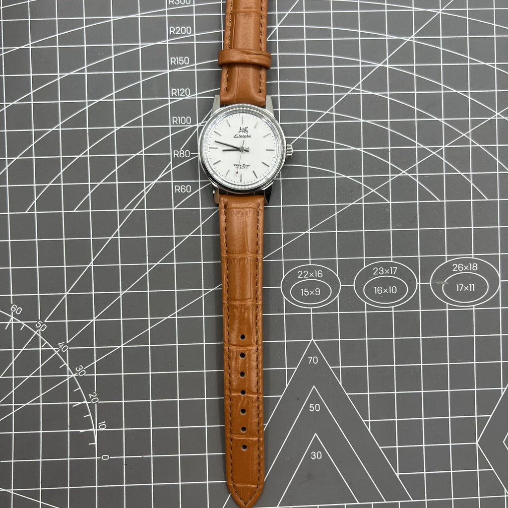 Shanghai Factory 32mm manual mechanical watch with silver case and classic silver hour markers.