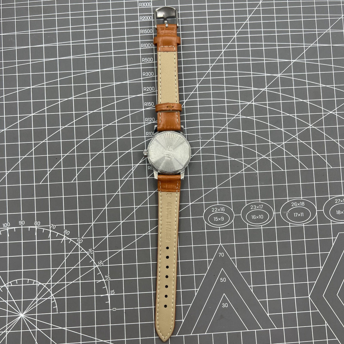 32mm Shanghai Factory manual mechanical watch with silver case and classic silver hour markers.