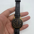 37mm automatic watch with black dial, golden Roman numerals, 33 jewels in classic style.