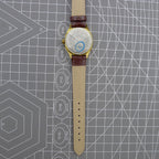 33mm Shanghai watch with blue dial and golden nail markers in square case, manual movement, 17 jewels.