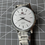 Beijing 31mm manual mechanical watch with silver case and three hands, stylish and precise timekeeping.