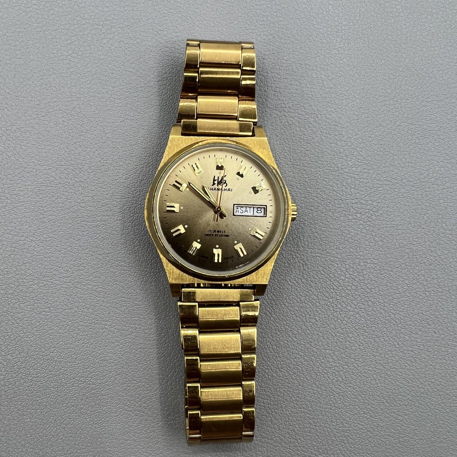 Shanghai Factory manual mechanical watch with dark brown dial featuring double calendar display.