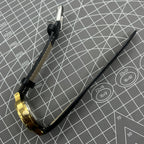 Black Dandong manual mechanical watch with 17 jewels, single calendar, golden dial, and classic design for elegant style.