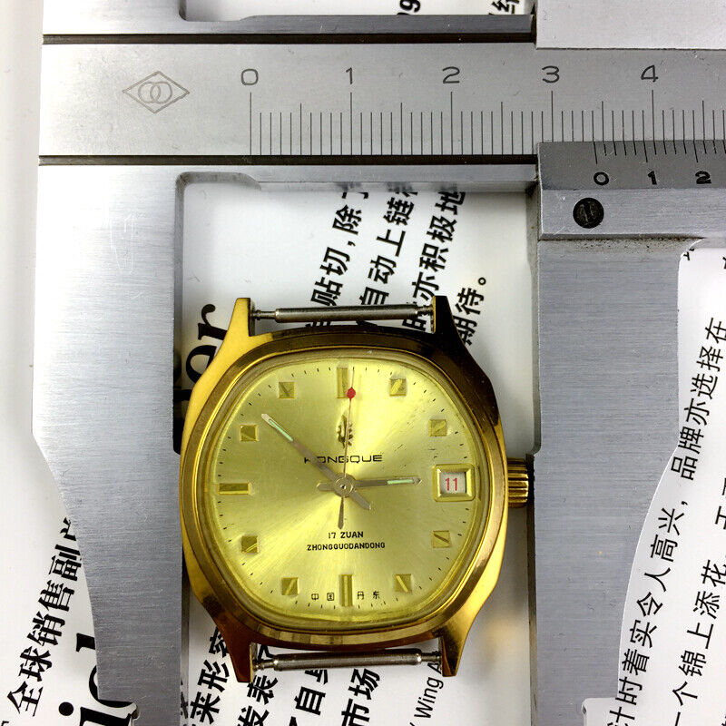 Black Dandong manual mechanical watch with 17 jewels and single calendar, golden dial for classic style.