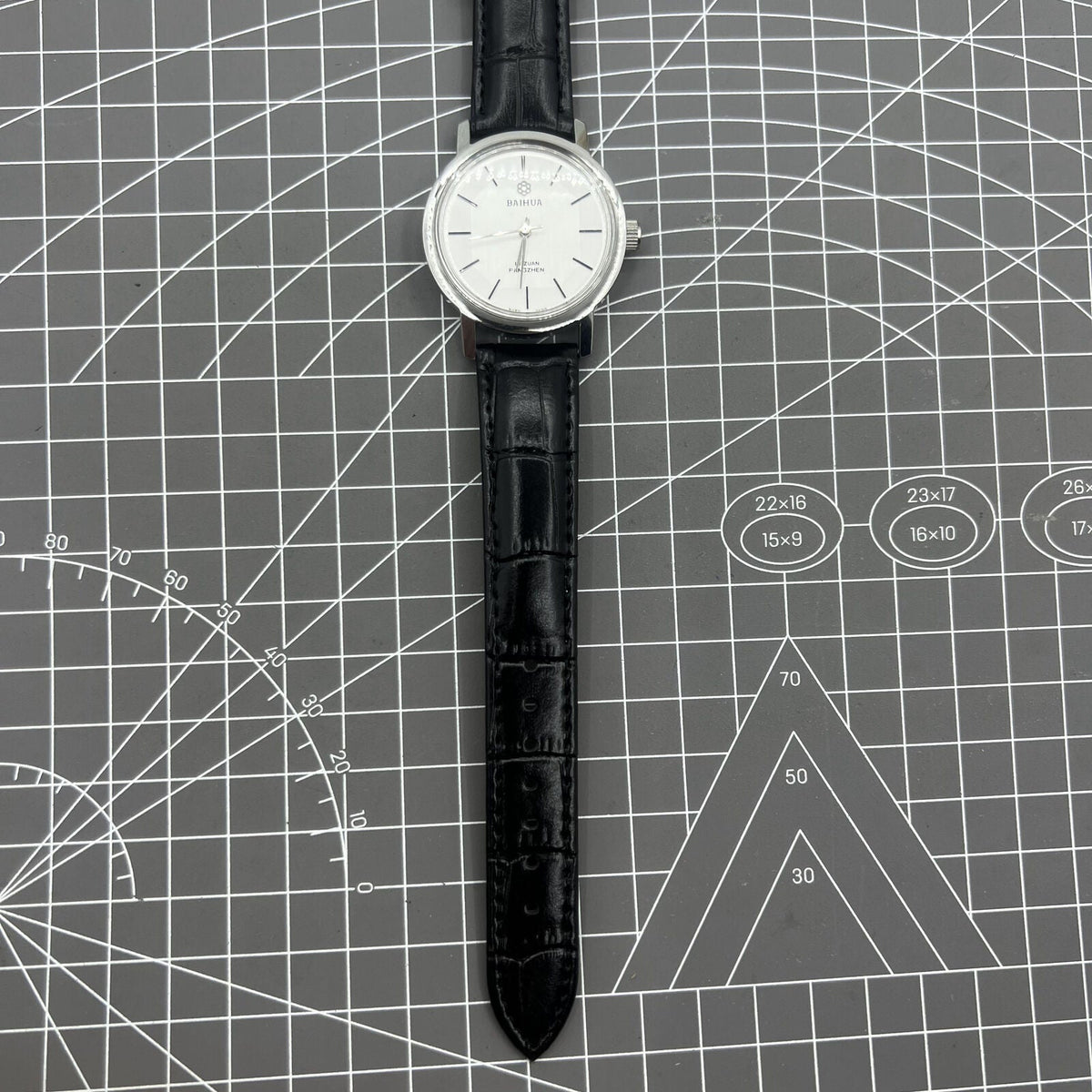 Baihua 37mm manual mechanical watch with silver dial, 19 jewels, shock-resistant for lasting performance.