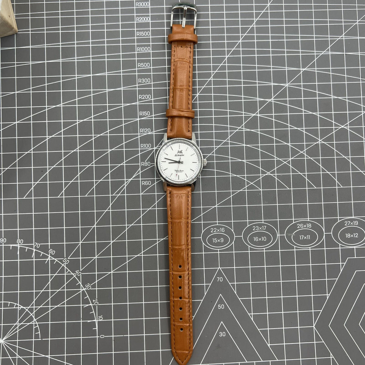 32mm Shanghai Factory manual mechanical watch with silver case and silver hour markers, classic design