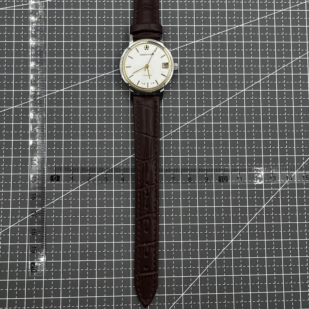 Shanghai 33mm manual mechanical watch with single calendar, 17 jewels, shock-resistant design for daily wear.