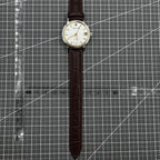 Shanghai 33mm manual mechanical watch with single calendar, 17 jewels, shock-resistant design for daily wear.