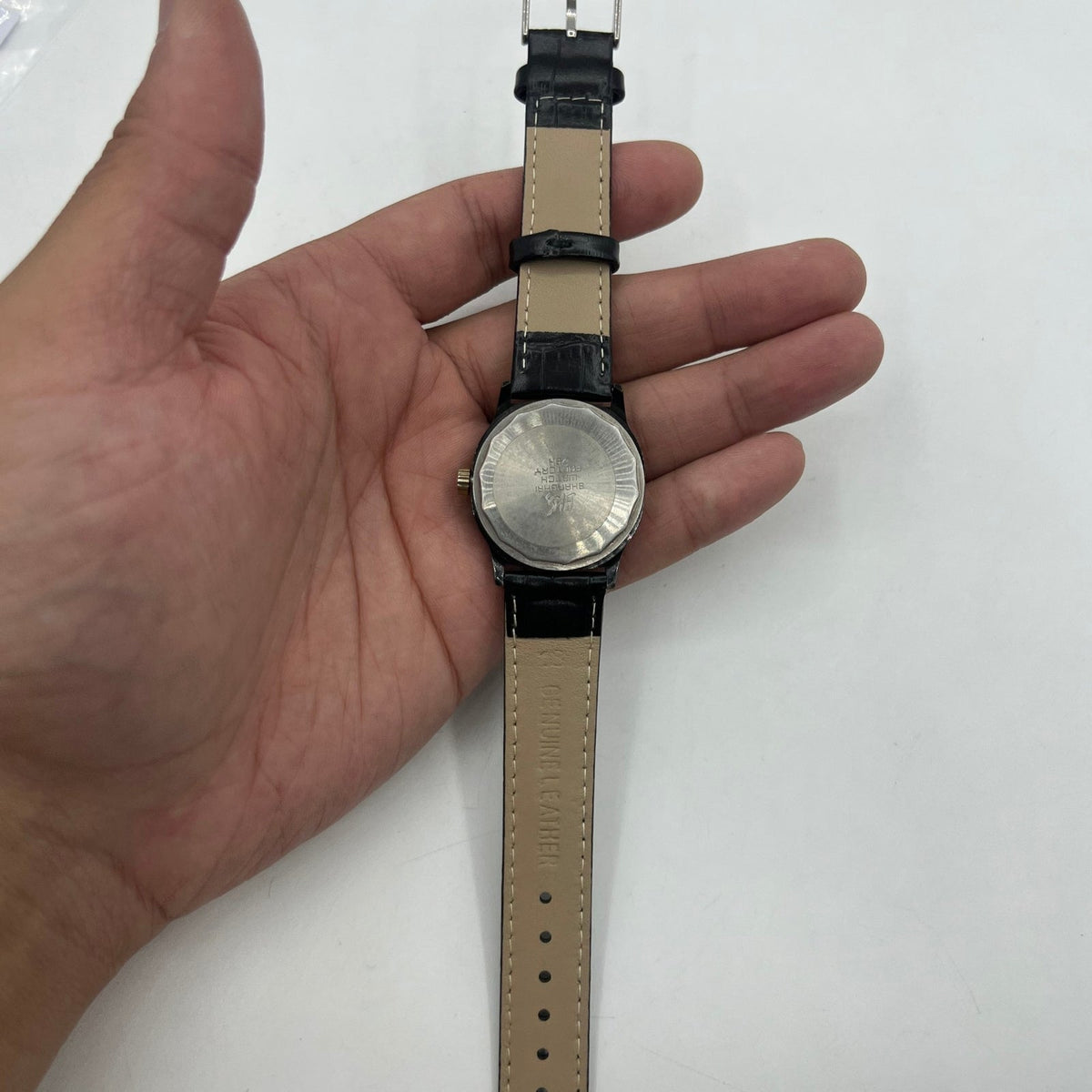 Shanghai Factory 34mm manual mechanical watch with black dial, 19 jewels, shock-resistant design for precision timekeeping.