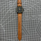34mm Shanghai Factory manual mechanical watch with black dial, 19 jewels, shock-resistant for everyday wear.