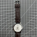 China Baihua 37mm manual mechanical watch with silver dial, 19 jewels, and shock-resistant design.