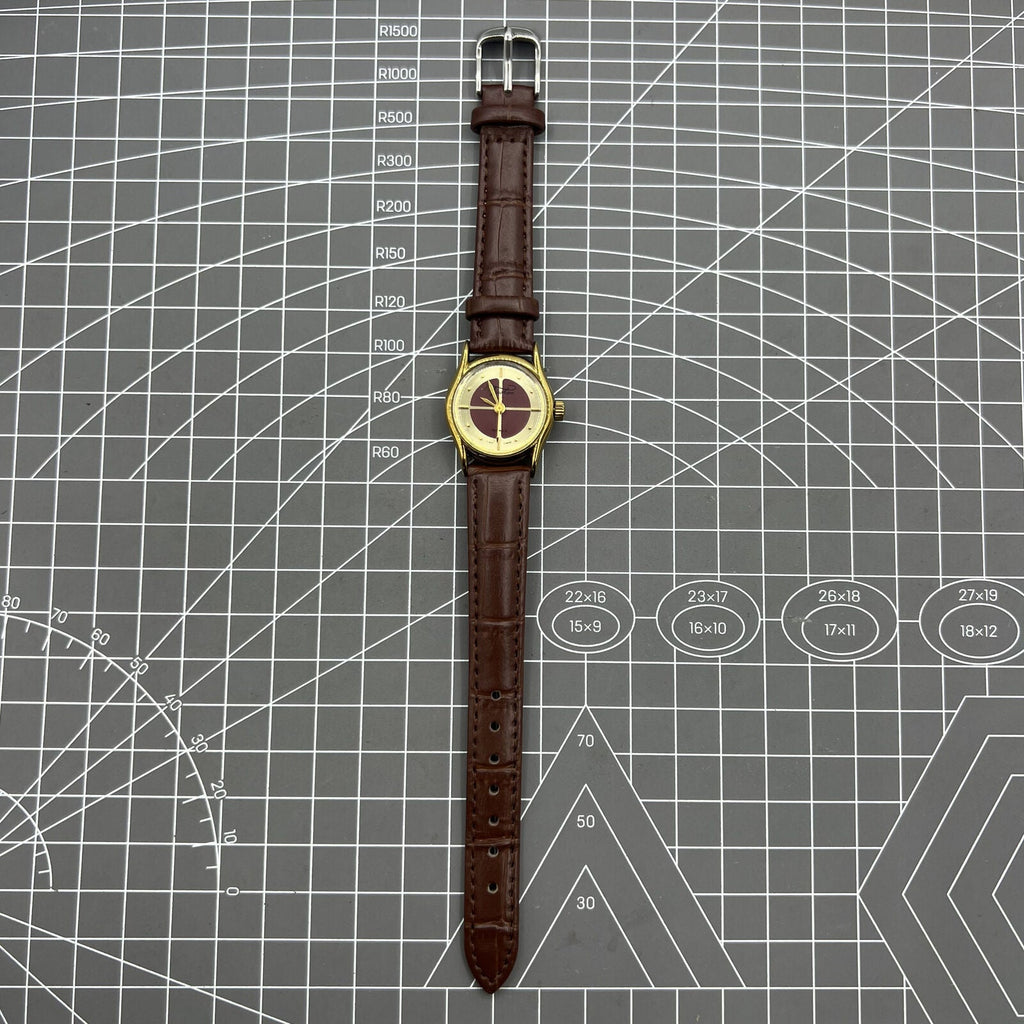 Brown 26mm Liaocheng TAISHAN manual mechanical lady watch with 19 jewels and golden nail details