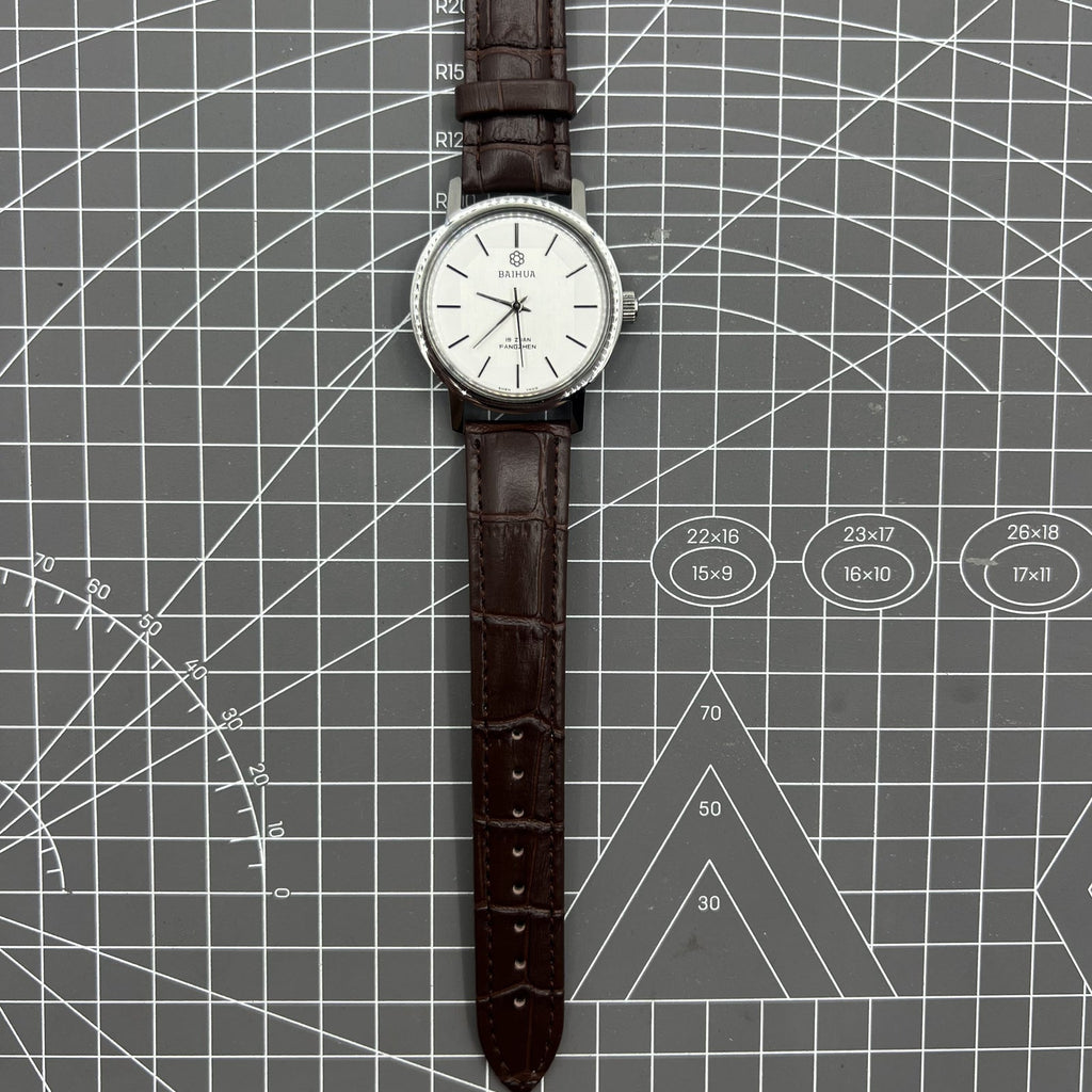 China Baihua 37mm manual mechanical watch with silver dial, 19 jewels, shock-resistant for daily wear.