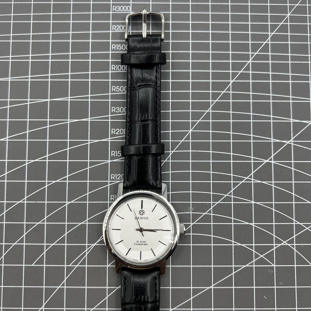 China Baihua 37mm manual mechanical watch with silver dial, 19 jewels, shock-resistant design for durability.