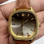 Shanghai 32mm manual mechanical watch with golden markers, brown dial, and octagonal case design.