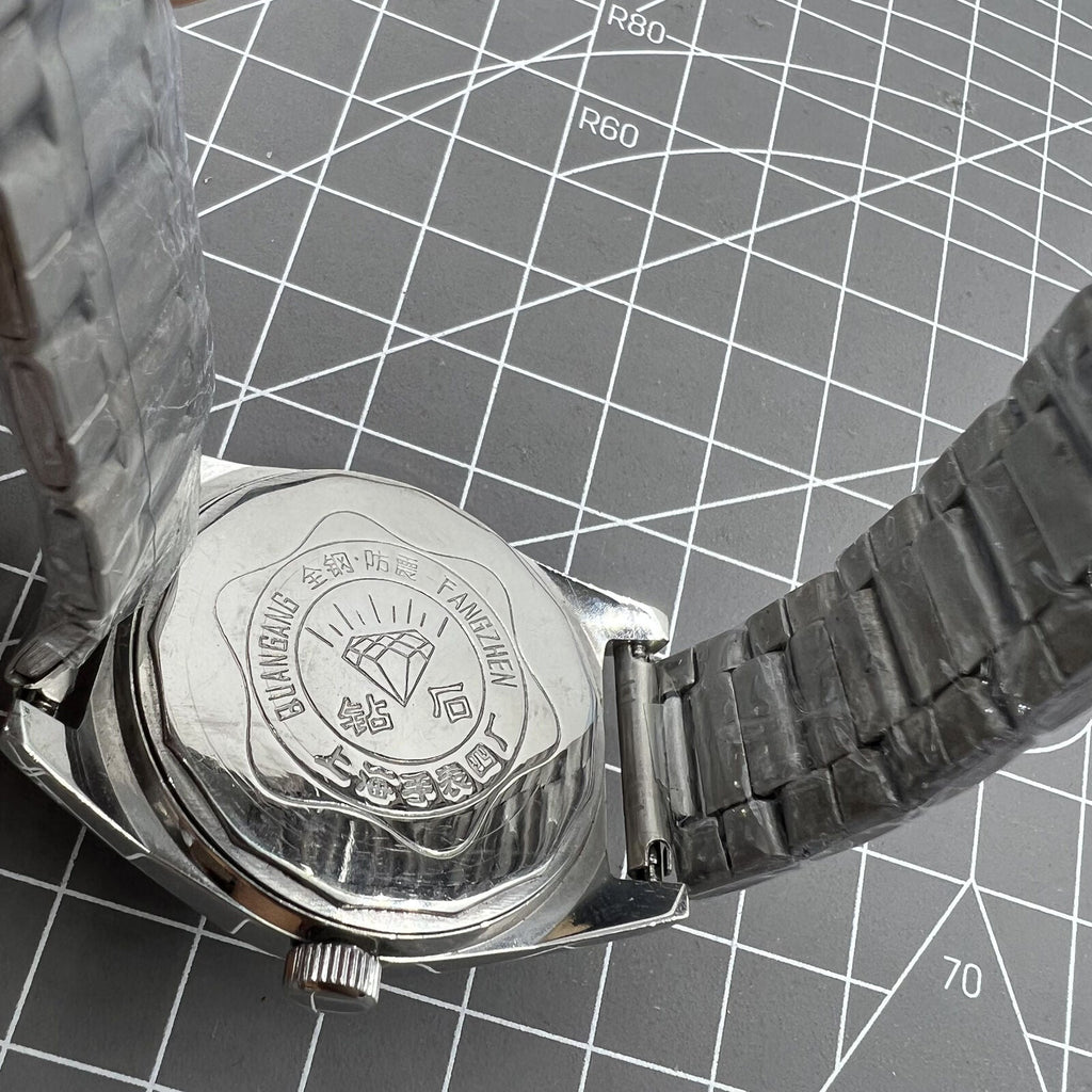 Shanghai Diamond 38mm mechanical watch with 17 jewels, white dial, silver case, elegant style by Shanghai Diamond.