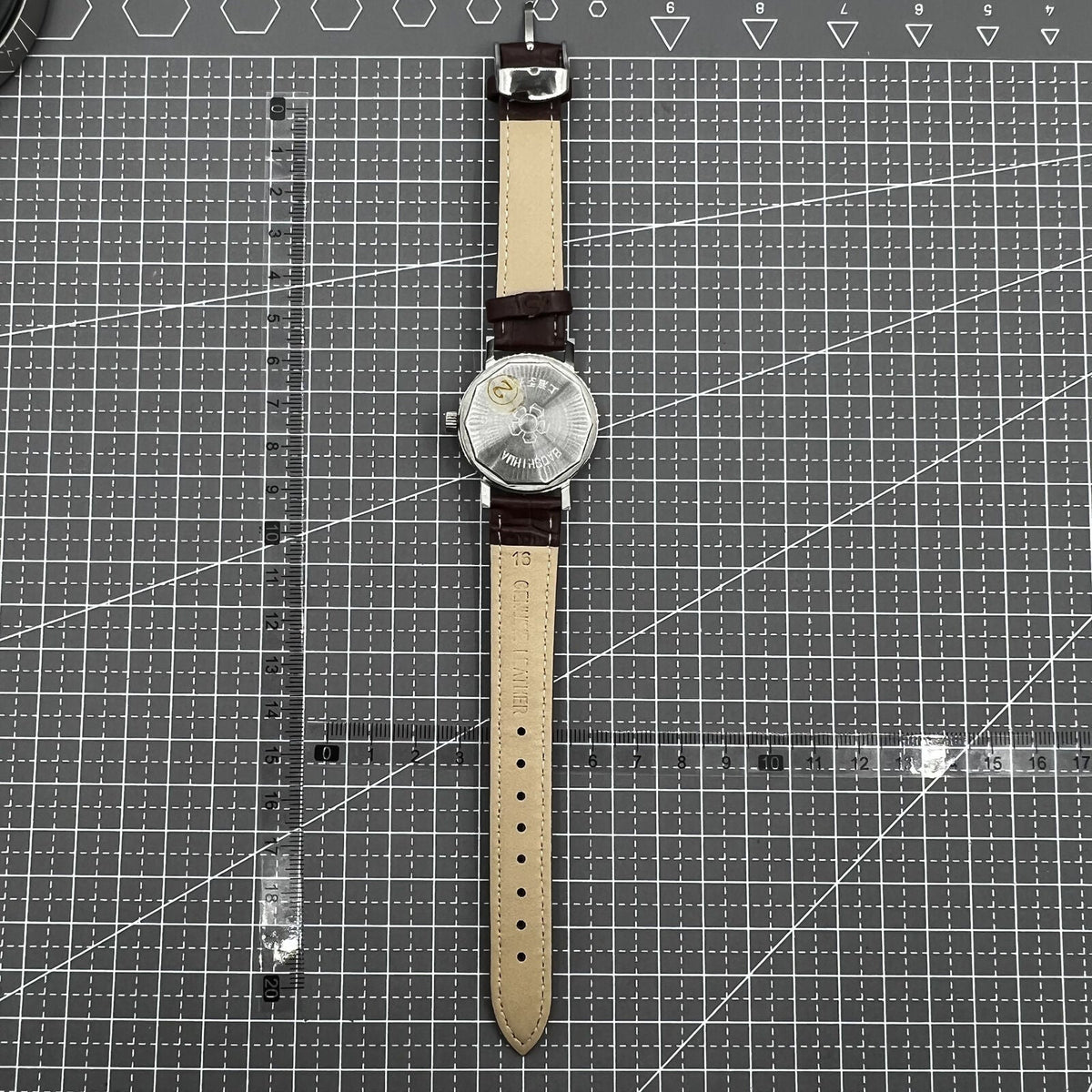 Shanghai 33mm manual mechanical watch with 17 jewels, single calendar, and shock-resistant design for precise timekeeping.