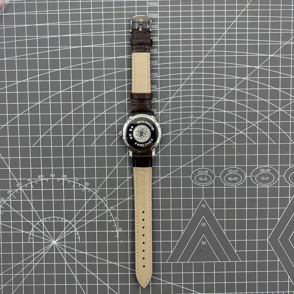 China Baihua 37mm manual mechanical watch with silver dial, 19 jewels, and durable shock-resistant build.