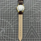 Beijing Double Rhomb manual watch with golden case, silver nail markers, classic style for elegant wear
