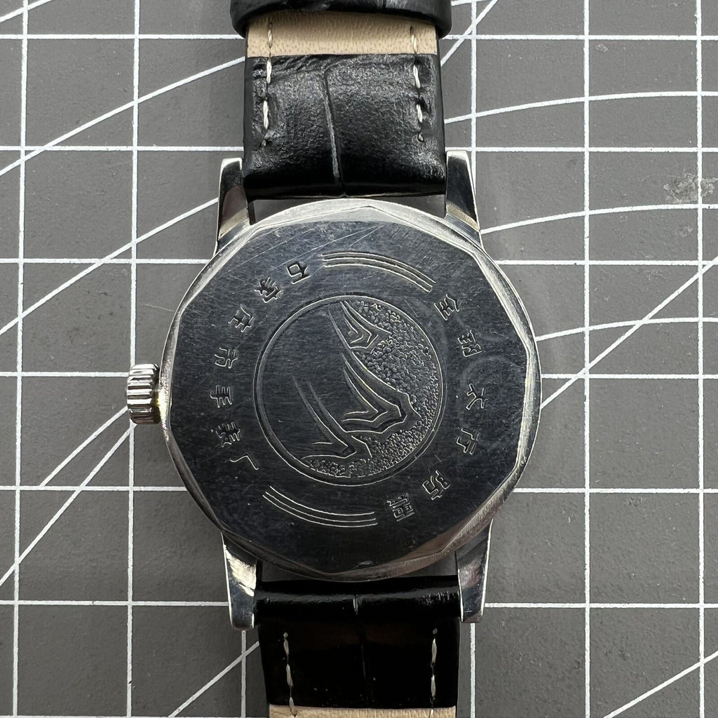 Taihang 32mm manual watch with black dial, gold nail markers, 17-jewel precision movement.