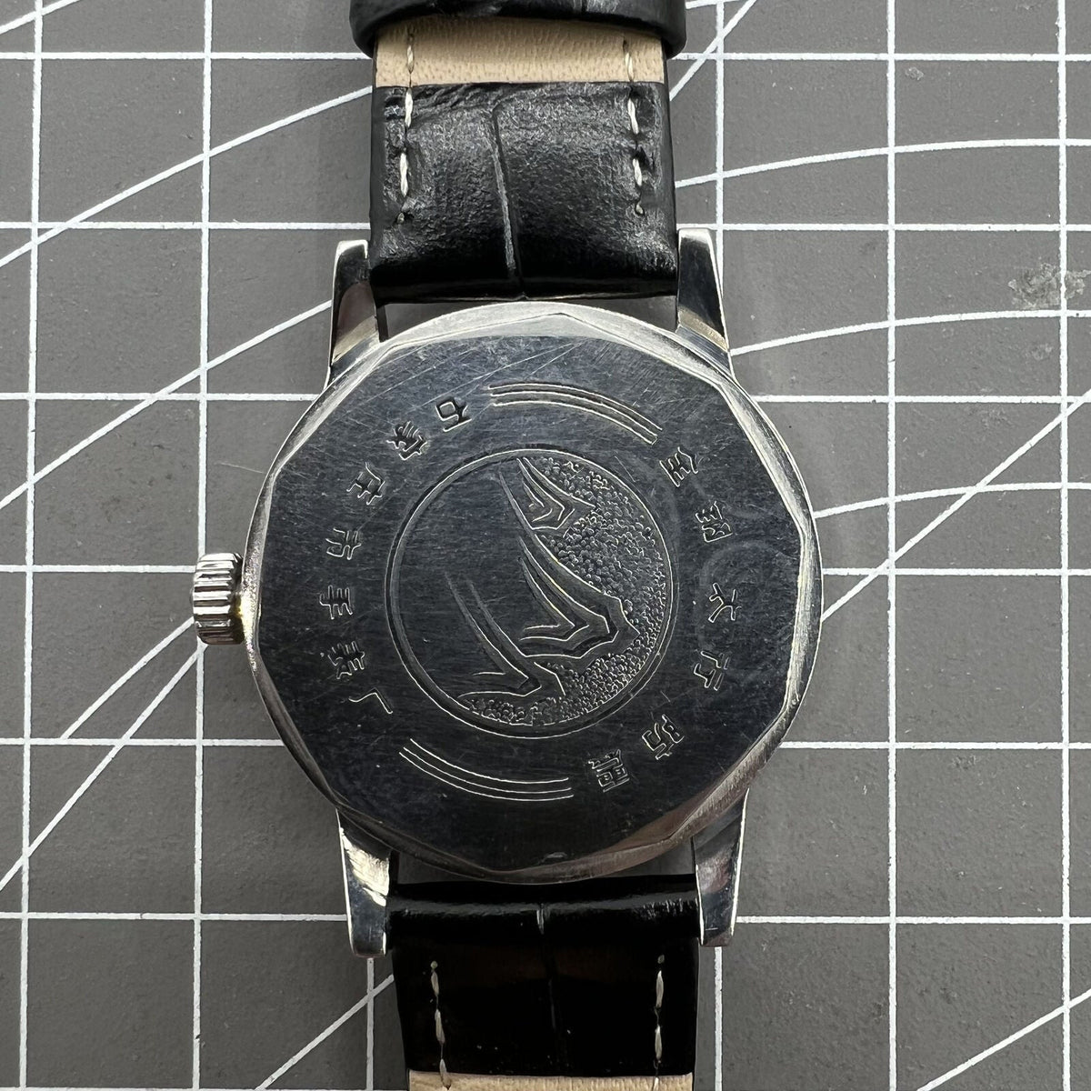 Taihang 32mm manual watch with black dial, gold nail markers, 17-jewel precision movement.