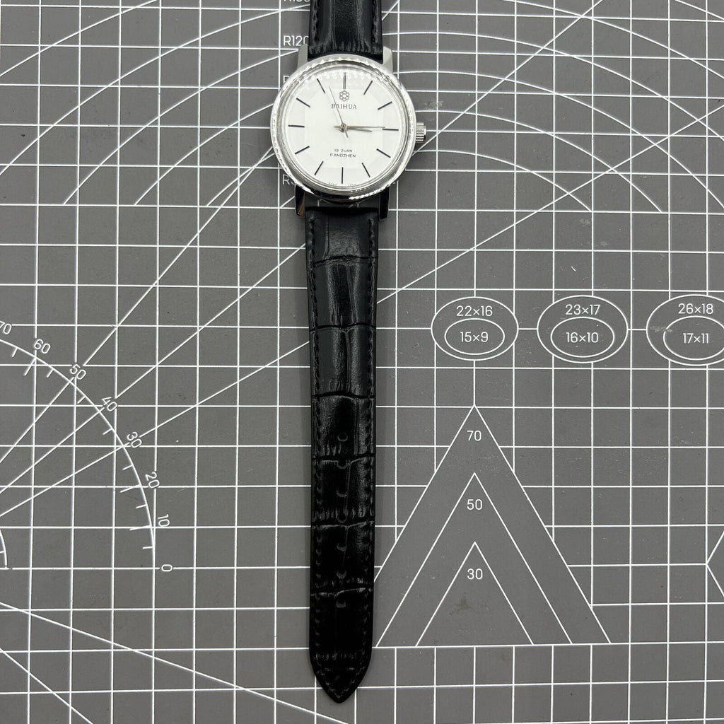China Baihua 37mm manual mechanical watch with silver dial, 19 jewels, shock-resistant for lasting precision.