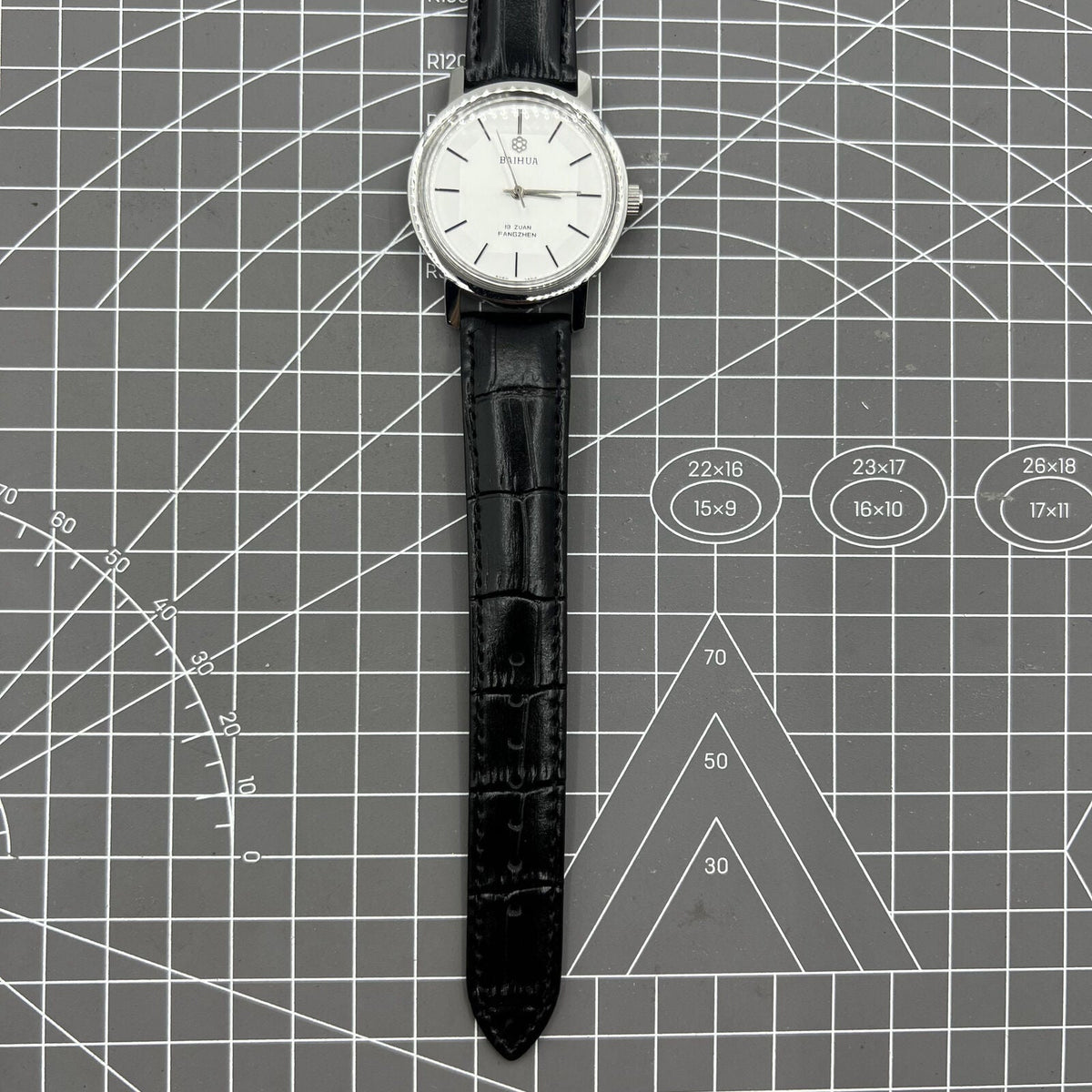 China Baihua 37mm manual mechanical watch with silver dial, 19 jewels, shock-resistant for lasting precision.