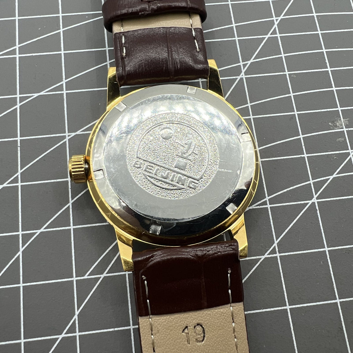Beijing Double Rhomb manual watch, golden case, silver nail markers, classic style for elegant occasions