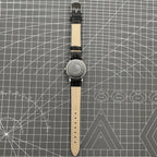 Taihang 32mm manual mechanical watch with black dial, golden markers, 17-jewel movement.