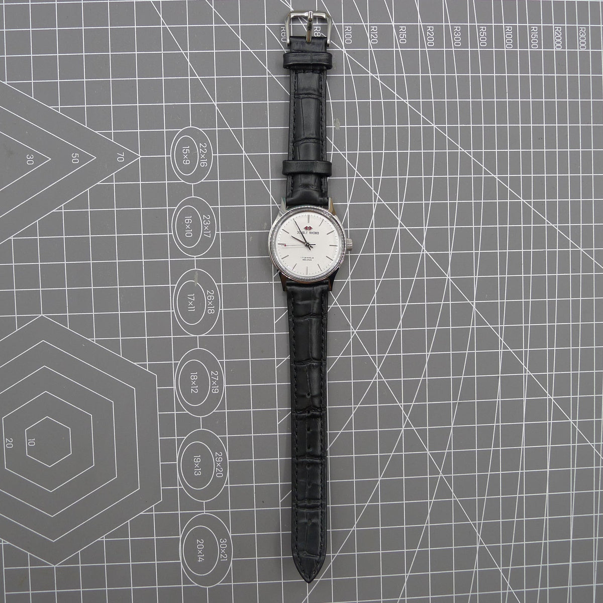 Beijing 31mm manual mechanical watch with silver case and double rhomb dial, classic Chinese craftsmanship.