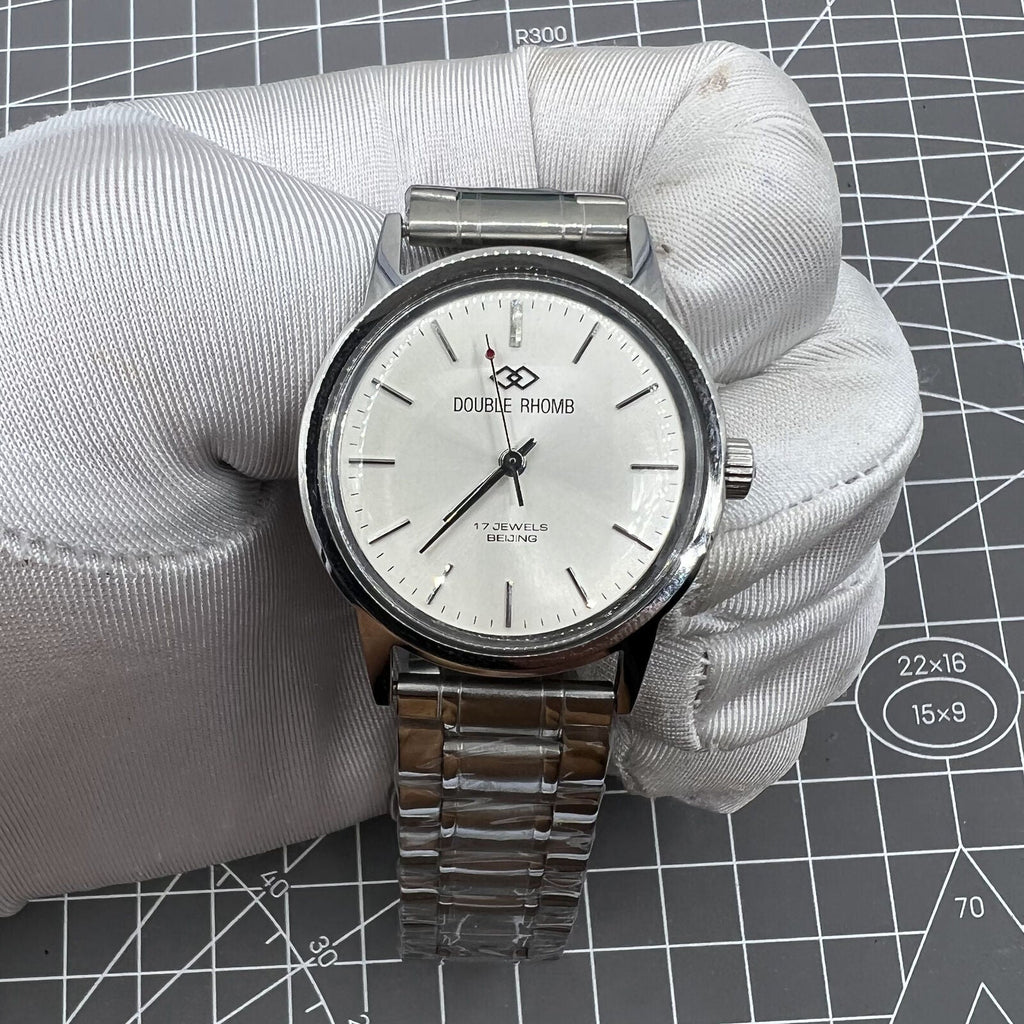 Beijing Silver 36mm Double Rhomb manual watch with silver case and nail markers, classic style timepiece.