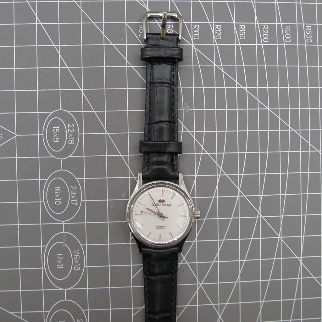 Beijing 31mm manual mechanical watch with silver case, double rhomb dial, showcasing classic Chinese craftsmanship.