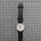 Beijing 31mm manual mechanical watch with silver case, double rhomb dial, showcasing classic Chinese craftsmanship.
