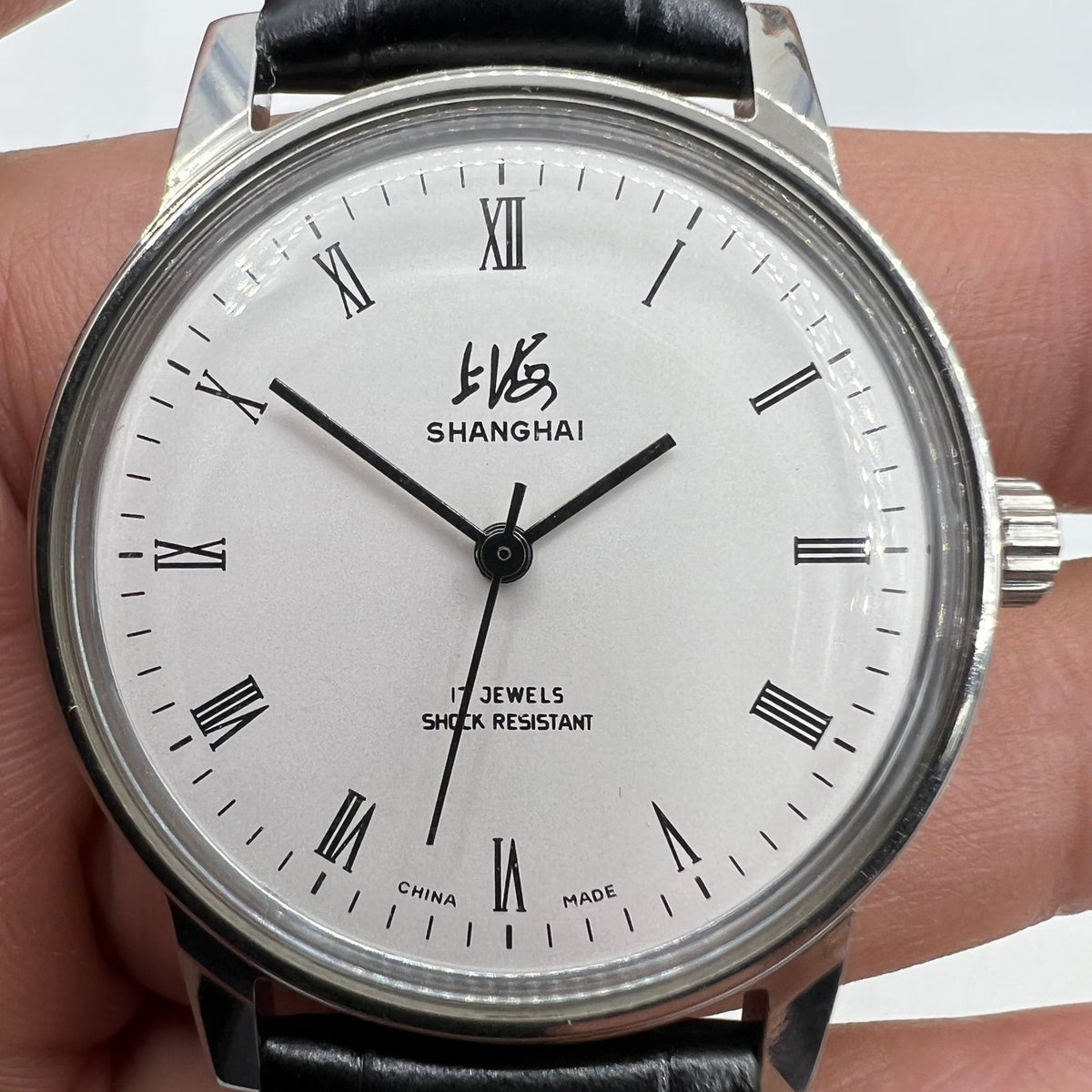 Shanghai Factory 36mm manual mechanical watch with 17 jewels, shock-resistant design for accurate timekeeping.