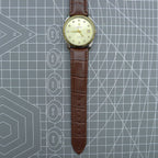 Dandong Peacock 37mm manual watch with golden dial, single calendar, 33 jewels, elegant style.