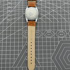 TAIHANG 38mm manual mechanical watch featuring golden hour markers, silver dial, round case, and 17 jewels for precision.