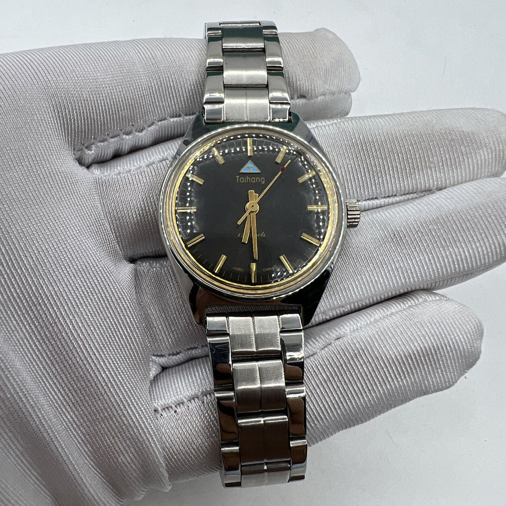 32mm Chinese Taihang manual watch, black dial with golden markers, 17 jewels precision movement.