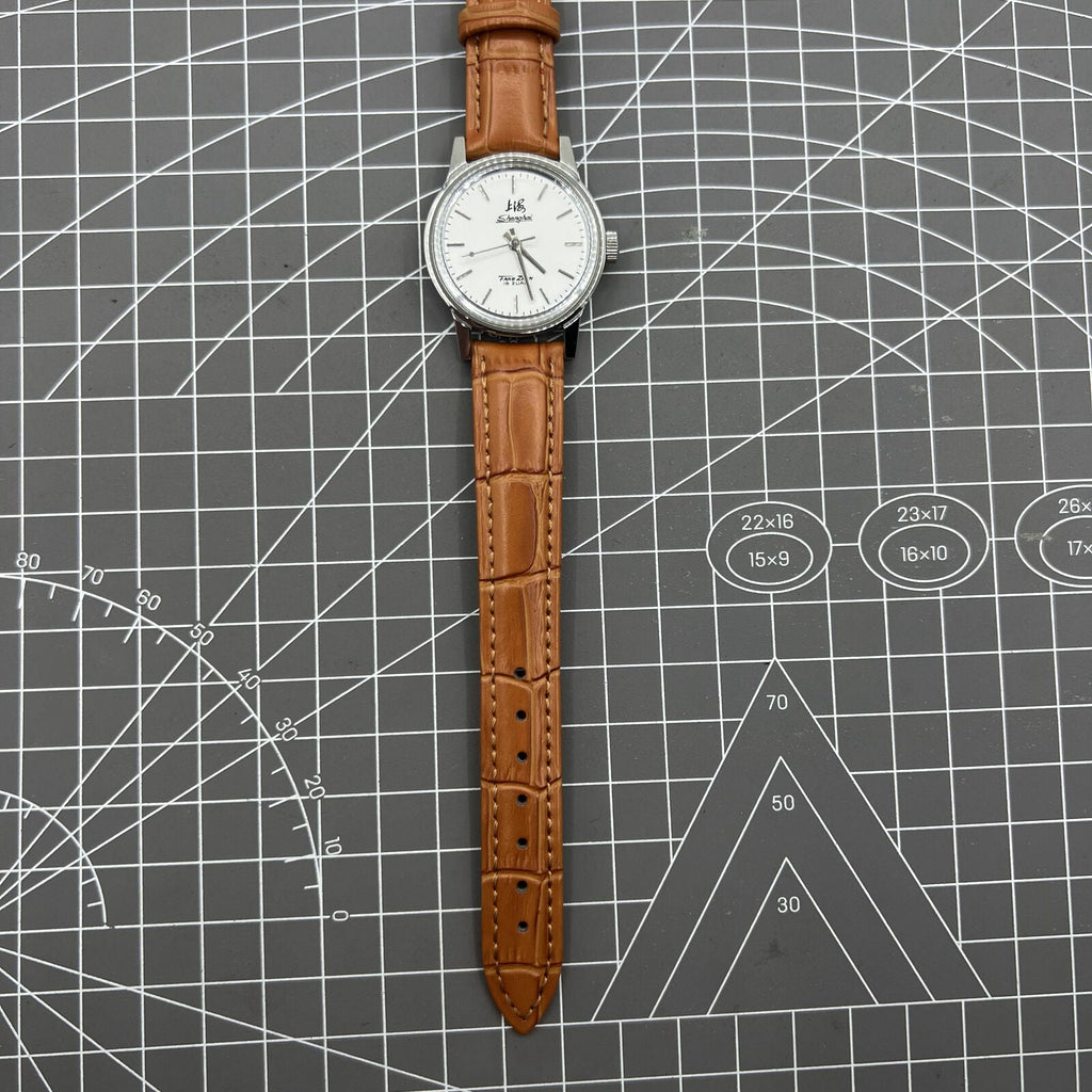 Shanghai Factory 32mm manual mechanical watch with 19 jewels, shock-resistant, classic design for elegant timekeeping.