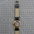 Beijing Double Rhomb mechanical watch, golden case with silver markers, elegant luxury timepiece.