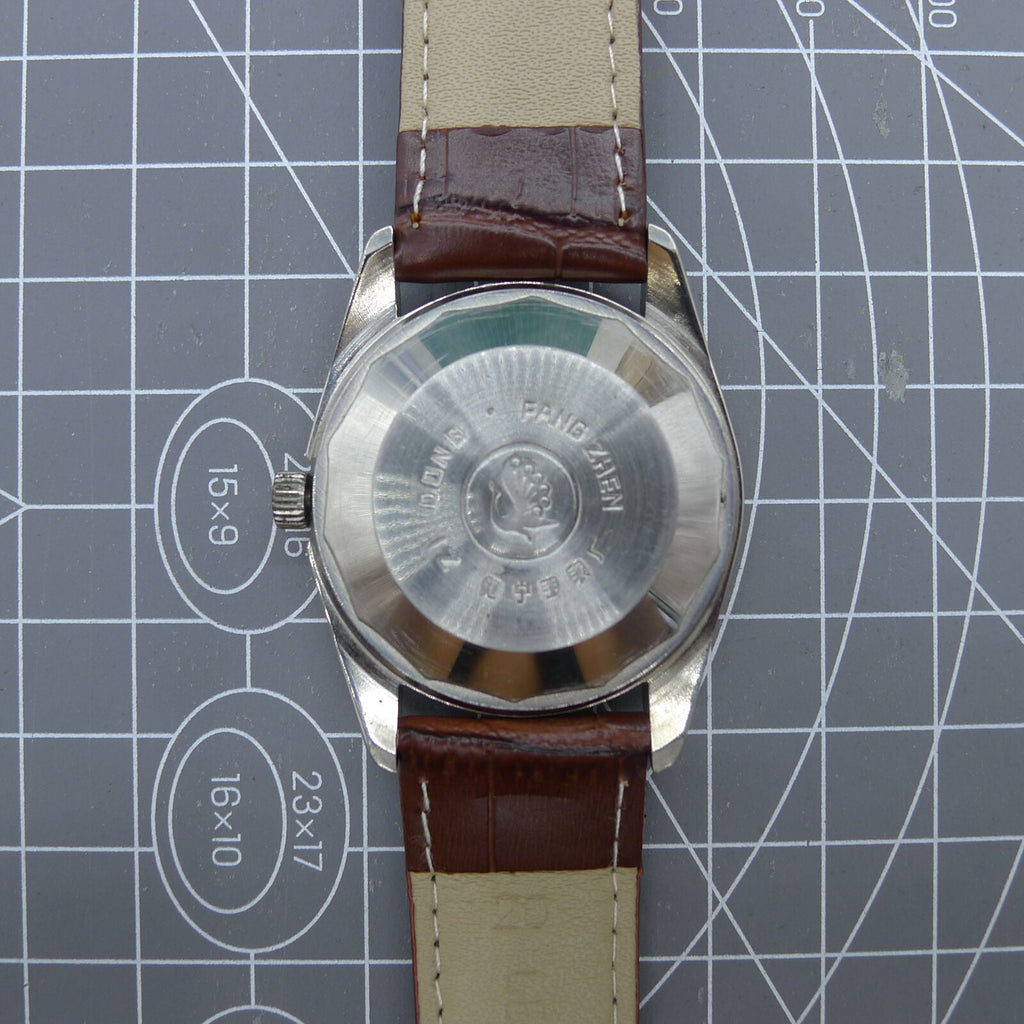 Dandong Peacock 37mm manual watch with golden dial, single calendar, 33 jewels, elegant design for refined style.