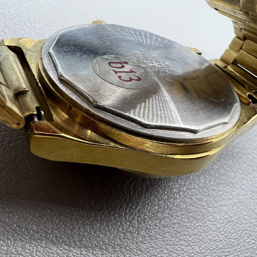 Shanghai Factory mechanical watch with dark brown dial, double calendar display, and elegant design.