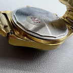 Shanghai Factory mechanical watch with dark brown dial, double calendar display, and elegant design.