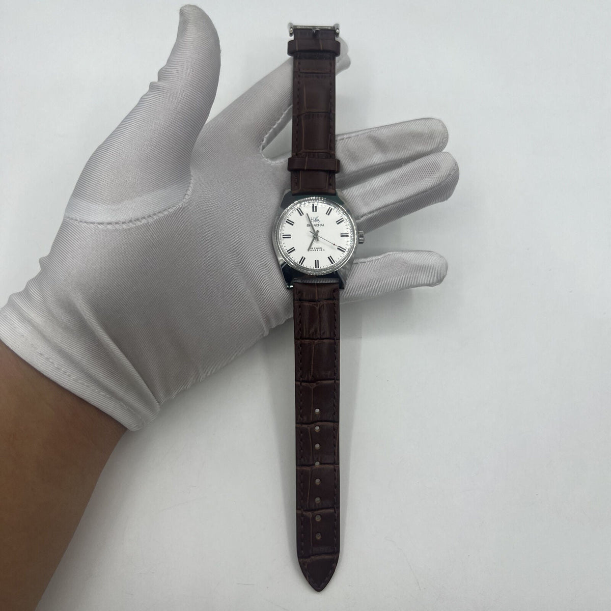 Shanghai Factory 38mm manual mechanical watch with white dial, 3 hands, 19 jewels, classic design.