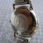 Beijing 36mm manual mechanical watch with silver case, nail-shaped markers, classic design by Beijing brand.