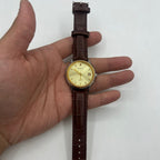 Shanghai 37mm manual watch with golden dial, nail markers, round case, 17 jewel mechanical movement.